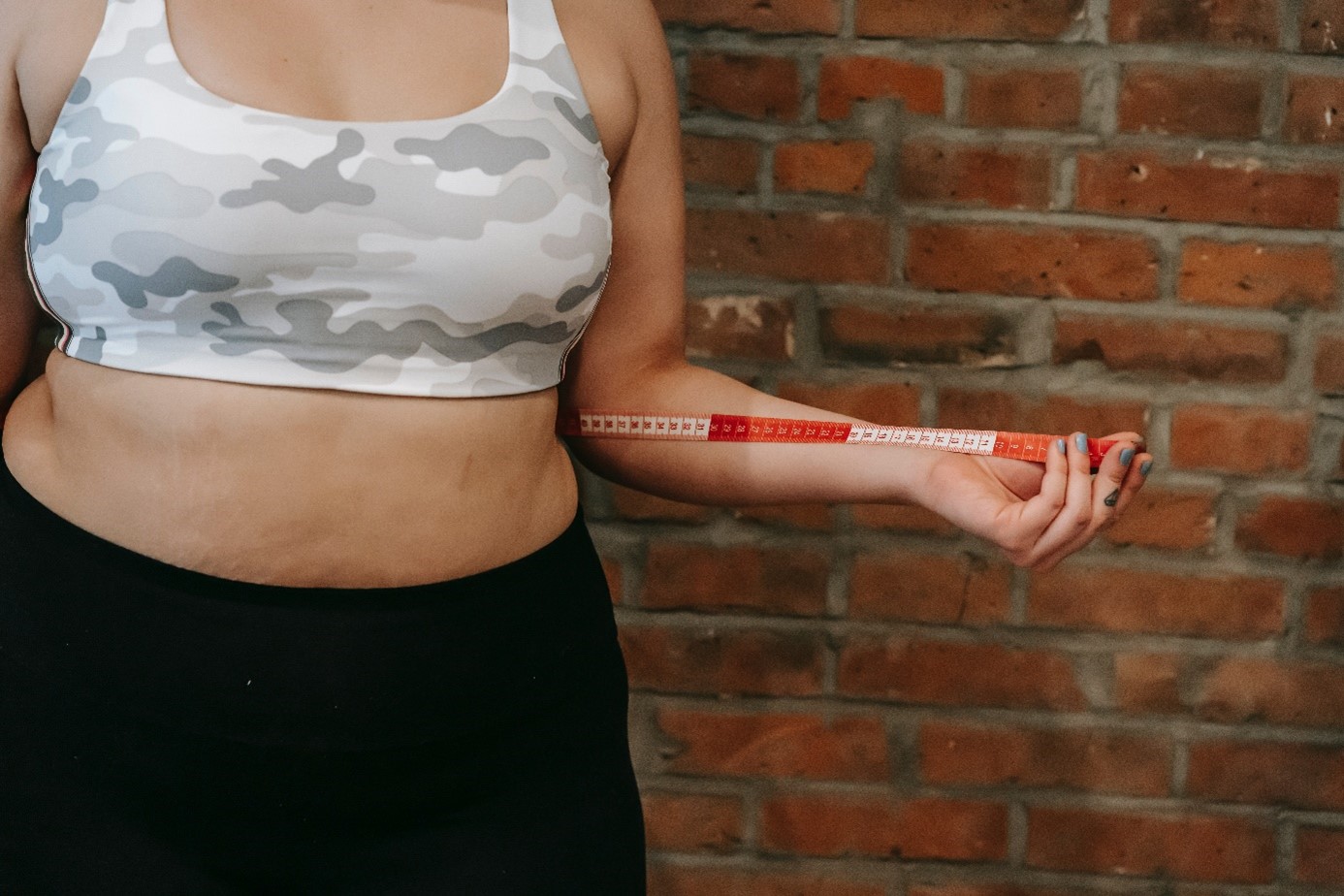 Woman Measuring Waist Circumference